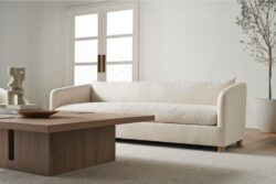 Rowe - Cream Sofa With Plush Cushions Near Wooden Coffee Table In Minimalist Living Room With White Walls And Large Windows