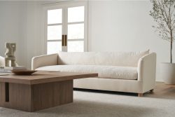 Rowe - Cream Sofa With Plush Cushions Near Wooden Coffee Table In Minimalist Living Room With White Walls And Large Windows