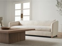 Rowe - Cream Sofa With Plush Cushions Near Wooden Coffee Table In Minimalist Living Room With White Walls And Large Windows