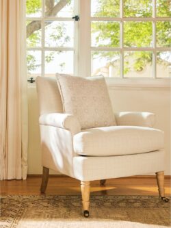 Rowe - Cream Upholstered Armchair With Patterned Pillow Near Window, On Wooden Floor, Home Decor