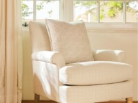 Rowe - Cream Upholstered Armchair With Patterned Pillow Near Window, On Wooden Floor, Home Decor