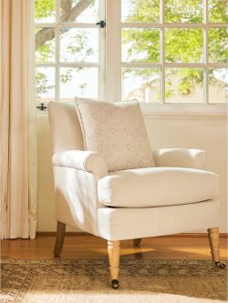 Rowe - Cream Upholstered Armchair With Patterned Pillow Near Window, On Wooden Floor, Home Decor