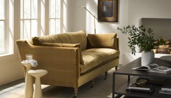 Rowe - Golden Velvet Sofa With Plush Cushions Near Large Window And Black Coffee Table Home Decor