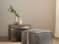 Rowe - Gray Cowhide Ottomans Under Wooden Console Table With White Vases And Green Leaves, Home Decor