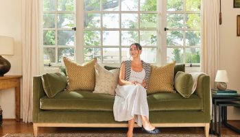 Rowe - Green Velvet Sofa With Gold And Beige Pillows Under Large Windows Home Decor Upholstery