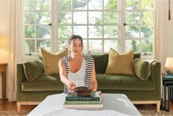 Rowe - Green Velvet Sofa With Gold Pillows Under Large Window Near Wooden Console Table Home Decor