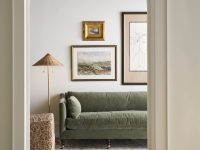 Rowe - Green Velvet Sofa With Plush Cushions Under Framed Artwork Near Patterned Lamp And Console Table