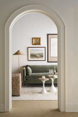 Rowe - Green Velvet Sofa With White Side Tables Under Framed Artwork Near Patterned Ottoman Home Decor