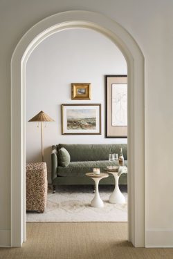 Rowe - Green Velvet Sofa With White Side Tables Under Framed Artwork Near Patterned Ottoman Home Decor