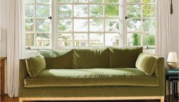 Rowe - Green Velvet Sofa With Wooden Legs On Patterned Rug Near Large Window, Home Decor, Upholstery