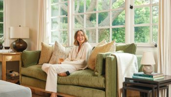 Rowe - Green Velvet Sofa With Yellow And Beige Pillows Under Large Windows Near Wooden Side Table Home Decor