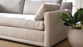 Rowe - Light Beige Sofa With Plush Cushions Near Potted Plant On Sisal Rug Upholstery Home Decor
