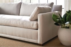 Rowe - Light Beige Sofa With Plush Cushions Near Potted Plant On Sisal Rug Upholstery Home Decor