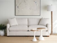 Rowe - Light Gray Sofa With Plush Cushions Near Two White Nesting Tables Under Abstract Art