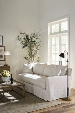 Rowe - Light Grey Sofa With Plush Cushions Under Large Window Near Black Floor Lamp Home Decor