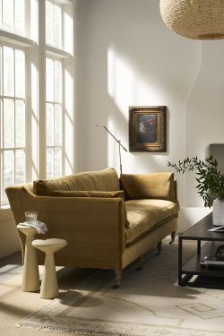 Rowe - Olive Green Velvet Sofa With Wooden Legs Near Large Windows And Framed Art