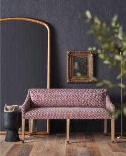 Rowe - Pink Patterned Sofa With Wooden Legs Near Wooden Console Table And Framed Art Home Decor