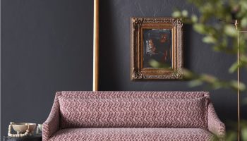 Rowe - Pink Patterned Sofa With Wooden Legs Near Wooden Console Table And Framed Art Home Decor