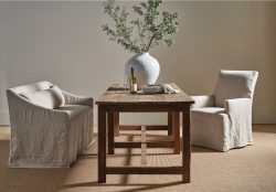 Rowe - Rustic Wooden Table With Two Beige Slipcovered Armchairs, White Vase With Greenery, Home Decor