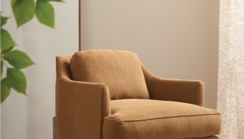 Rowe - Tan Upholstered Armchair With Metal Legs On Rug Near Large Mirror Home Decor