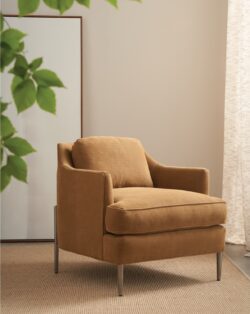 Rowe - Tan Upholstered Armchair With Metal Legs On Rug Near Large Mirror Home Decor