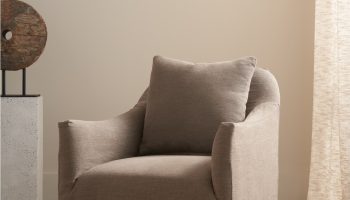 Rowe - Taupe Armchair With Slipcover And Pillow Near Wooden Sculpture And Curtain, Home Decor Upholstery