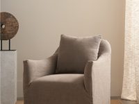 Rowe - Taupe Armchair With Slipcover And Pillow Near Wooden Sculpture And Curtain, Home Decor Upholstery
