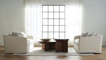 Rowe - Two Beige Sofas With Plush Cushions Under Large Window Near Wooden Coffee Tables On Light Rug In Living Room