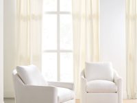 Rowe - Two White Swivel Armchairs With Plush Cushions On Beige Rug Near Large Window With Curtains Home Decor