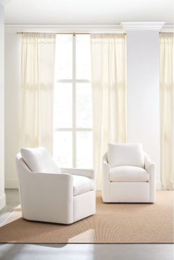 Rowe - Two White Swivel Armchairs With Plush Cushions On Beige Rug Near Large Window With Curtains Home Decor
