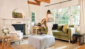 Rowe - White Armchair And Green Sofa With Ottoman Under Wooden Beams Near Large Windows Home Decor