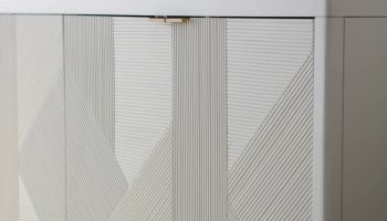 Rowe - White Console Table With Geometric Ribbed Panel Doors Under Wooden Console Table Near Large Mirror Home Decor