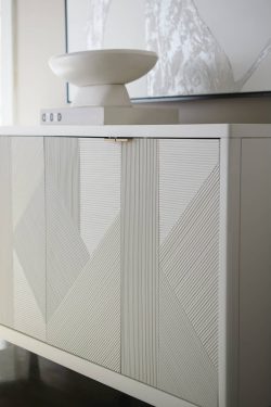 Rowe - White Console Table With Geometric Ribbed Panel Doors Under Wooden Console Table Near Large Mirror Home Decor