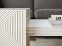 Rowe - White Geometric Ribbed Coffee Table With Books Near Grey Sofa Home Decor