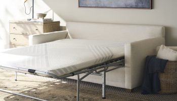 Rowe - White Sofa Bed With Pull-Out Mattress Under Wooden Console Table Near Large Mirror