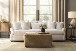 Rowe - White Sofa With Plush Cushions Under Large Window Near Wooden Console Table, Beige Ottoman, Home Decor