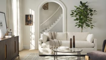 Rowe - White Sofa With Throw Blanket Under Archway Near Wooden Console Table, Large Plant, Home Decor, Upholstery