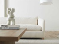 Rowe - White Sofa With Wooden Coffee Table Near Modern Sculpture And Floor Lamp In Minimalist Home Decor