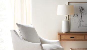 Rowe - White Swivel Armchair With Plush Cushions Under Wooden Console Table Near Large Mirror