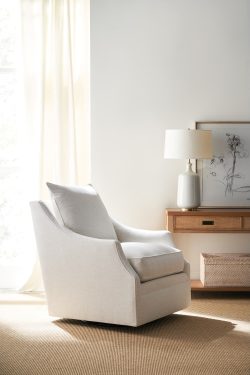 Rowe - White Swivel Armchair With Plush Cushions Under Wooden Console Table Near Large Mirror