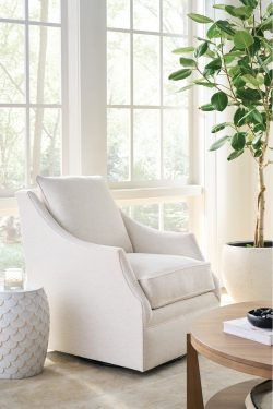 Rowe - White Swivel Chair With Plush Cushions Near Large Windows With Plant, Beside Textured Side Table, Home Decor
