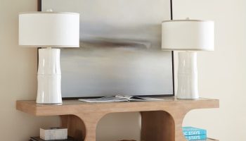 Rowe - Wooden Console Table With White Lamps Geometric Cutouts Books And Woven Basket Home Decor