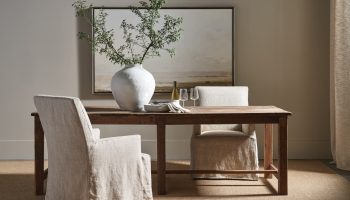 Rowe - Wooden Dining Table With Beige Slipcovered Chairs, White Vase Centerpiece, Under Framed Art, Home Decor