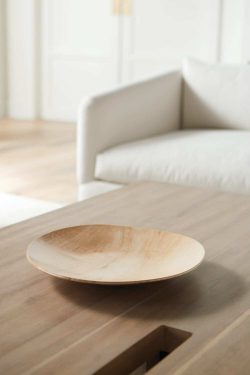 Rowe - Wooden Plate On Light Wood Coffee Table Near White Sofa Home Decor