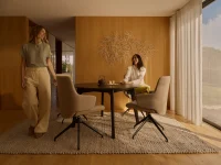 Friends enjoying tea at Stressless Laurel dining chairs in light beige